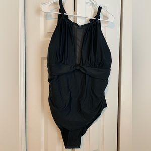 Black one piece bathingsuit with sheer material in the front.